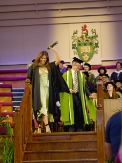 Maddie raises a cheer.